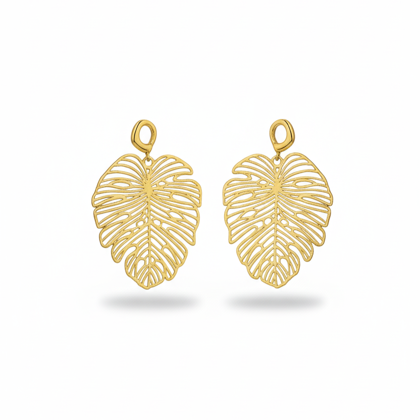 Gold leaf-shaped earrings on a white background