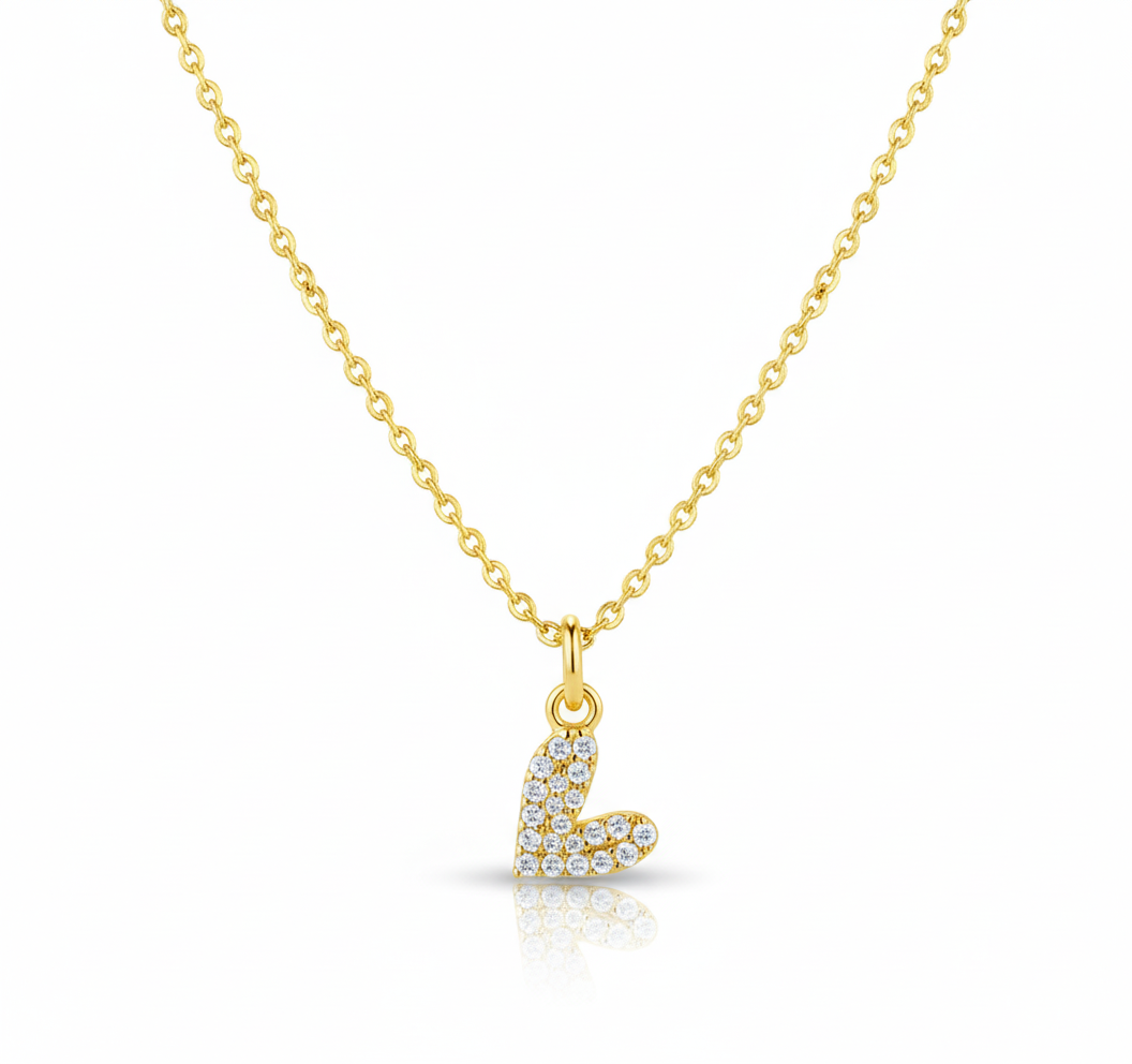 Gold necklace with a heart pendant on a white background