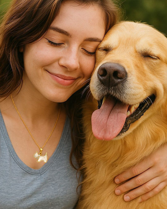 Woman hugging a golden dog with a blurred green background